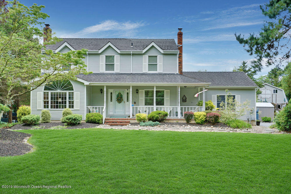205 Forge Road West Creek, NJ 08092 - Photo 39 of 64 a front view of a house with a yard and porch