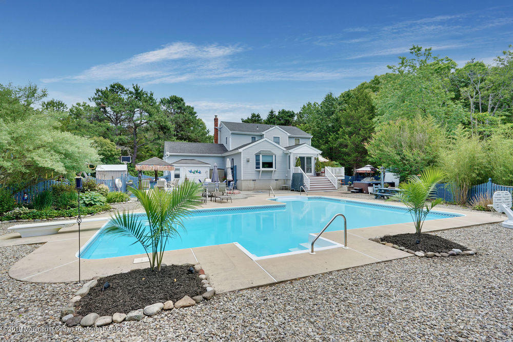 205 Forge Road West Creek, NJ 08092 - Photo 45 of 64 a front view of a house with garden