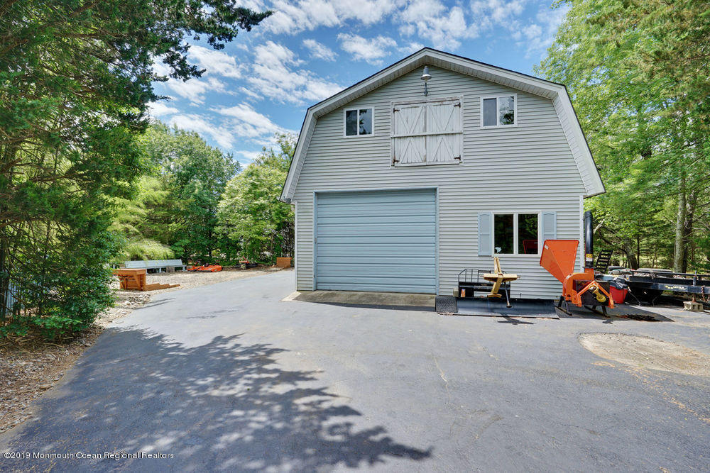 205 Forge Road West Creek, NJ 08092 - Photo 47 of 64 a view of car parked in front of a house