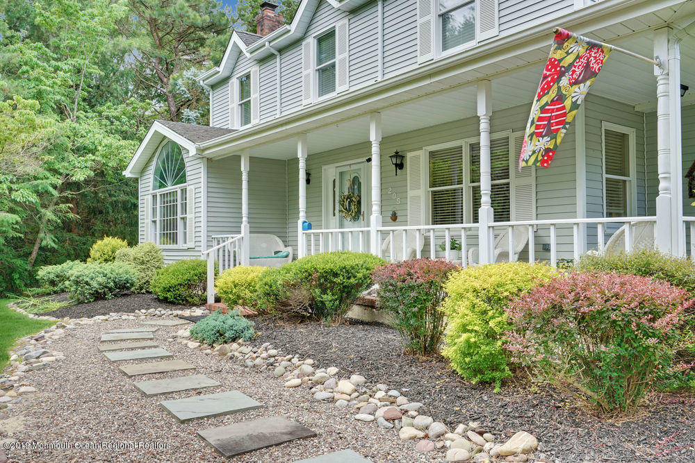 205 Forge Road West Creek, NJ 08092 - Photo 5 of 64 a front view of a house with garden