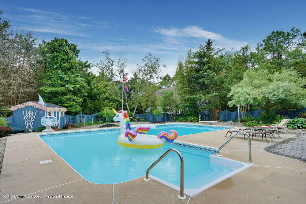 205 Forge Road West Creek, NJ 08092 - Photo 8 of 64 a view of a swimming pool with a lounge chairs