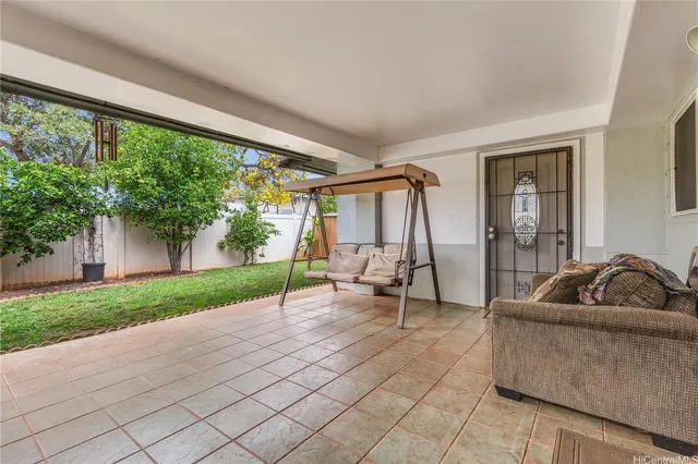 a living room with couch and a large window