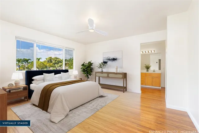 a bedroom with a bed and a view of kitchen