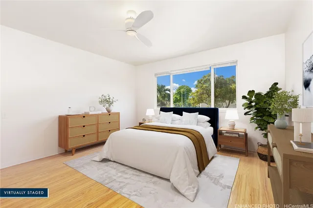 a bedroom with a large bed and a window