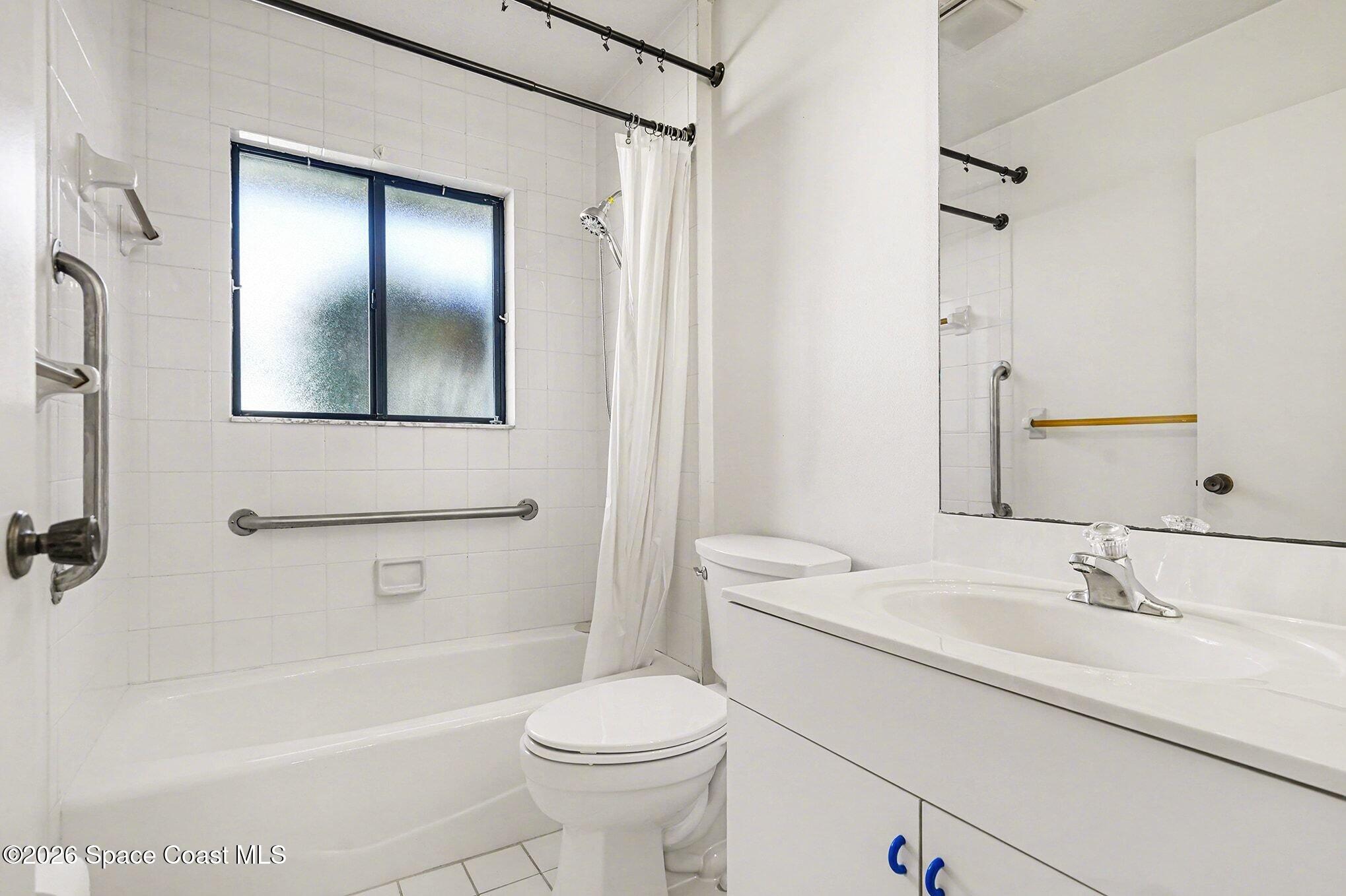 1741 Freedom Drive Melbourne, FL 32940 - Photo 20 of 37 a bathroom with a sink a toilet and shower