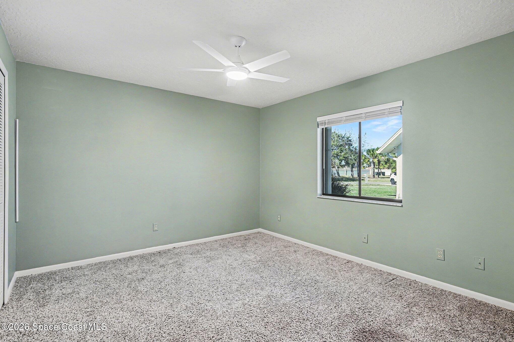 1741 Freedom Drive Melbourne, FL 32940 - Photo 21 of 37 an empty room with a window