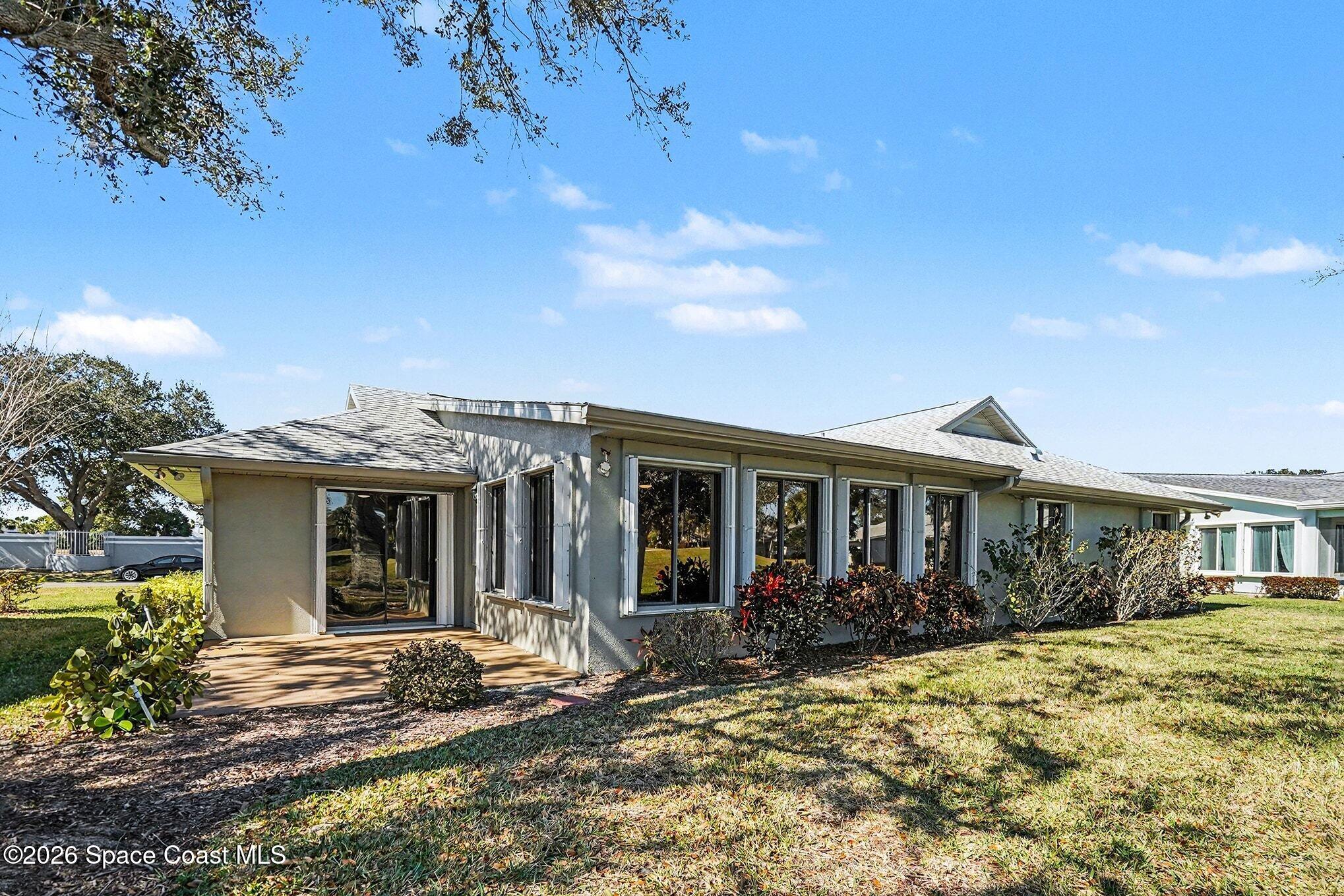 1741 Freedom Drive Melbourne, FL 32940 - Photo 23 of 37 front view of a house with a patio