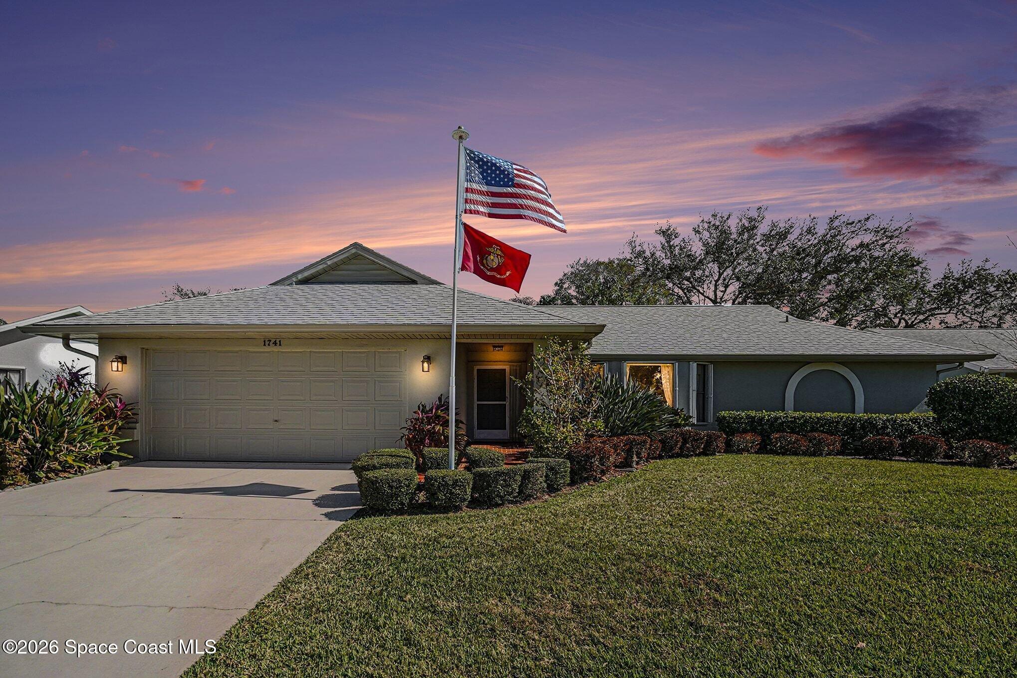 1741 Freedom Drive Melbourne, FL 32940 - Photo 26 of 37 a front view of a house with garden