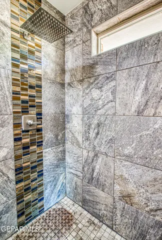a view of a patio with table and chairs and potted plants