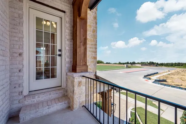 a view of balcony with furniture