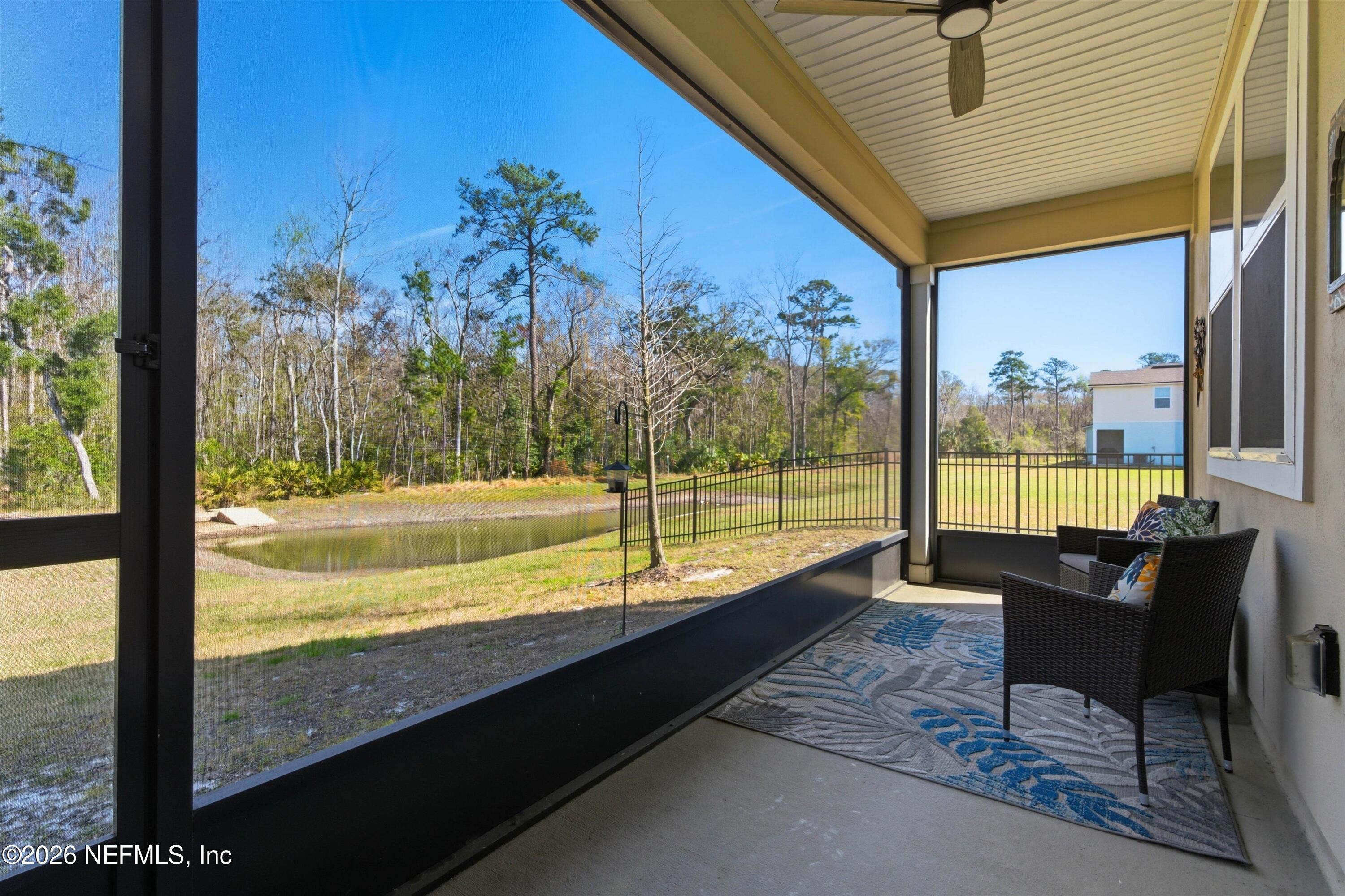 103 Seaport Breeze Road St. Augustine, FL 32095 - Photo 26 of 44 a view of a living room and floor to ceiling window and an outdoor kitchen