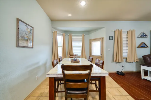 a dining room with furniture and window