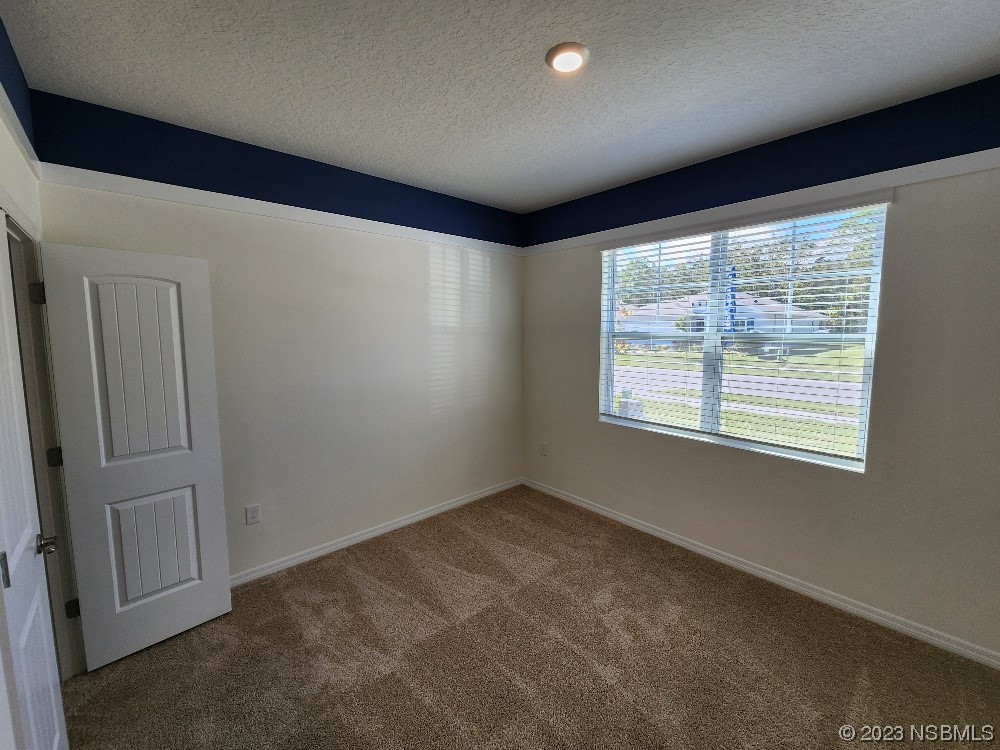 1839 Red Rock Road New Smyrna Beach, FL 32168 - Photo 13 of 23 an empty room with a window