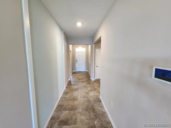 a view of a hallway with a white walls