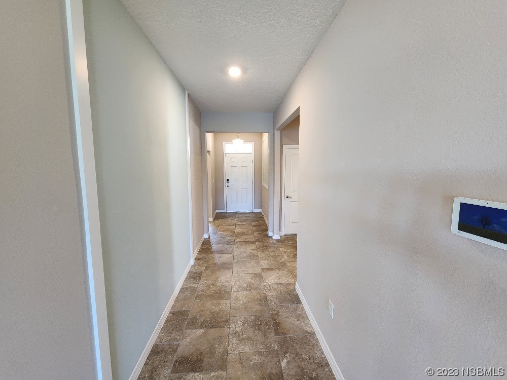 1839 Red Rock Road New Smyrna Beach, FL 32168 - Photo 6 of 23 a view of a hallway with a white walls