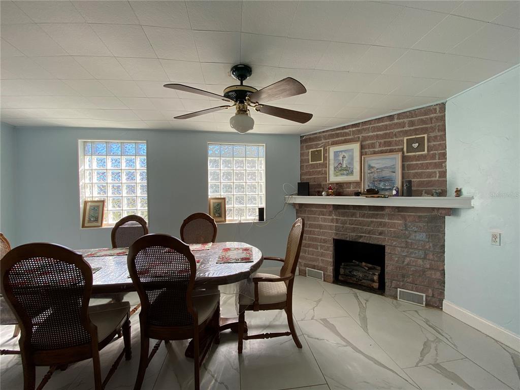 910 Lake Avenue Edgewater, FL 32132 - Photo 7 of 23 a dining room with furniture and window