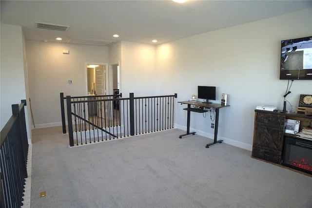 a view of a hallway with windows