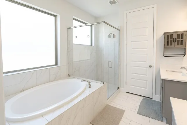 a white bath tub sitting in a bathroom