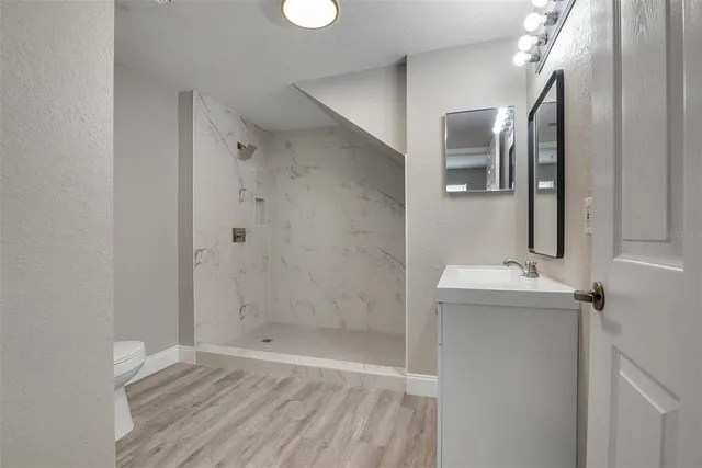 a bathroom with a sink and mirror