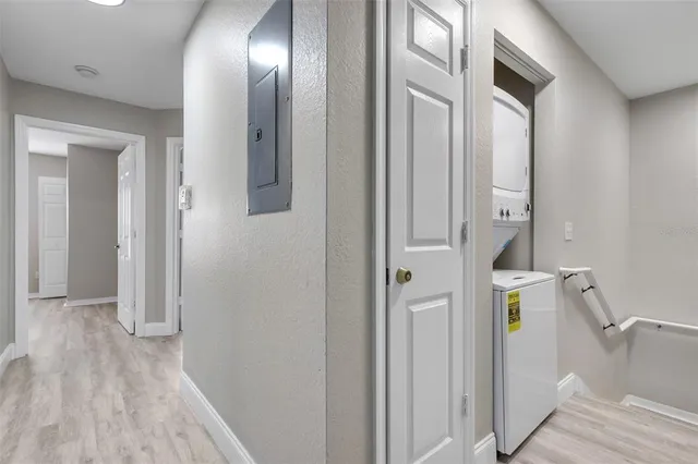 a view of an entryway with wooden floor