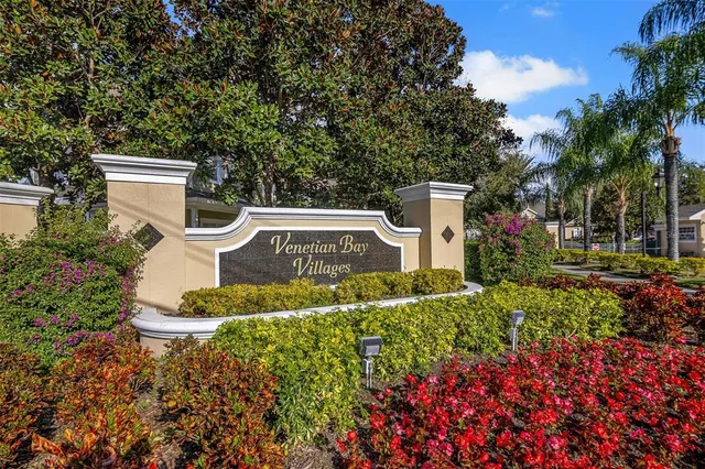 a aerial view of a house with a yard and fountain