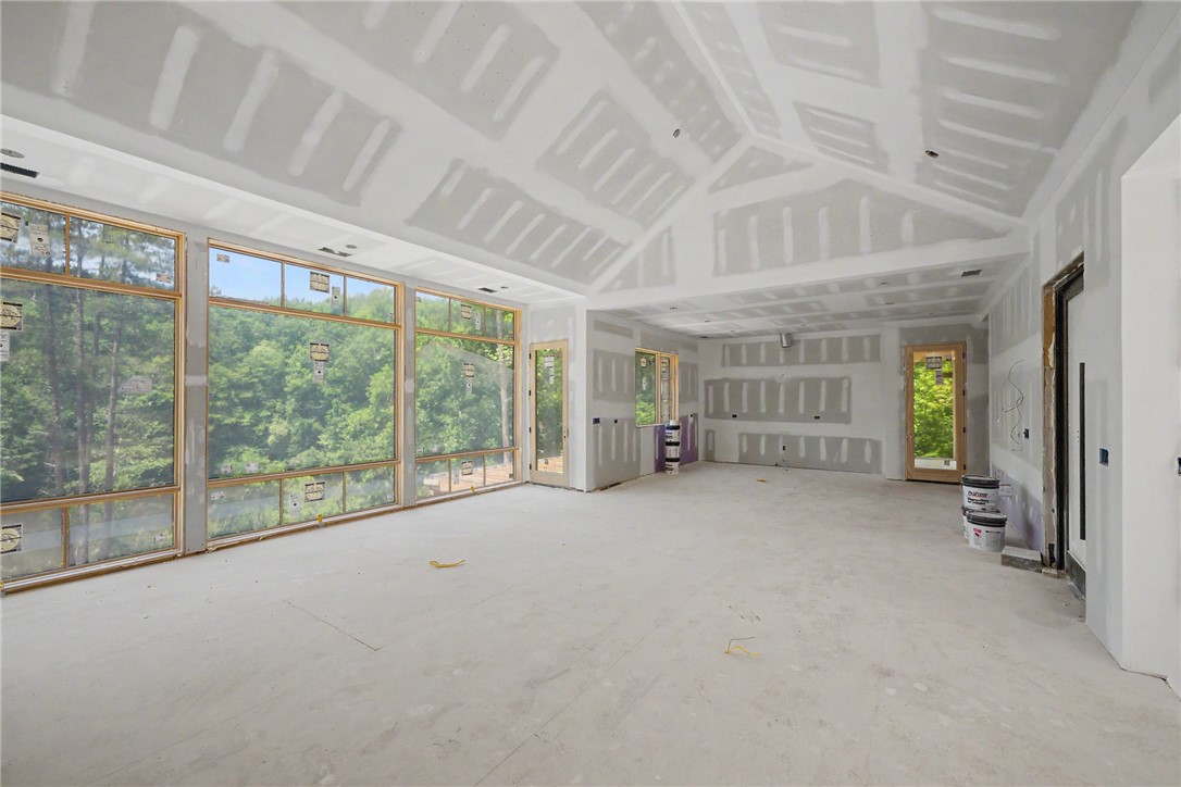 166 Ellenburg Creek Road Sunset, SC 29685 - Photo 6 of 20 Vast window walls invite nature inside this contemporary space.