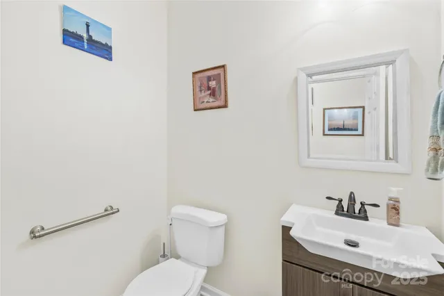 a bathroom with a sink toilet and vanity