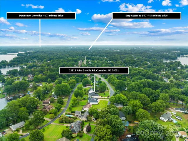 an aerial view of a house with a lake view