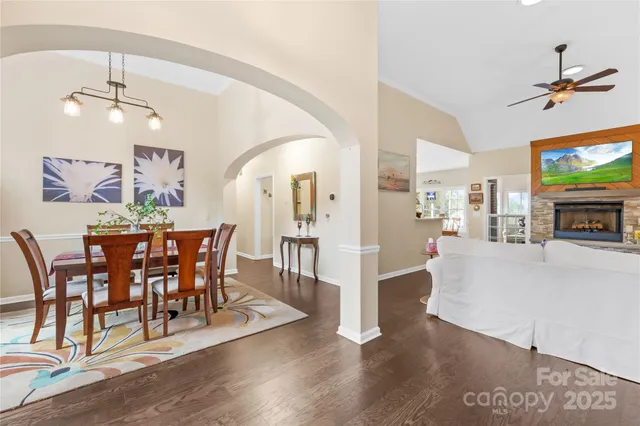 a view of a dining room with furniture and wooden floor