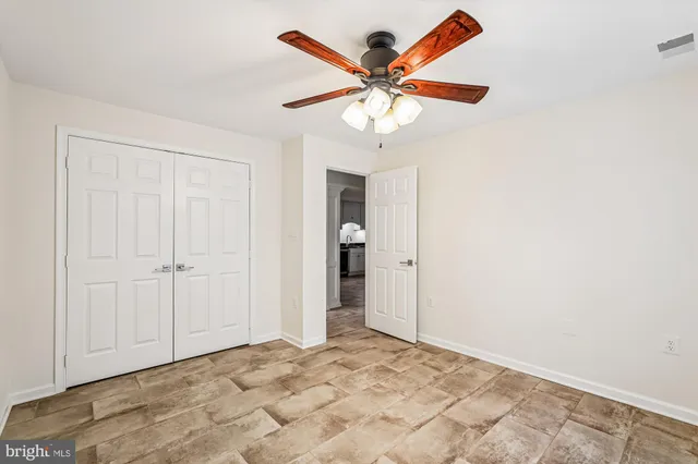 a view of a livingroom with a fireplace and cabinet