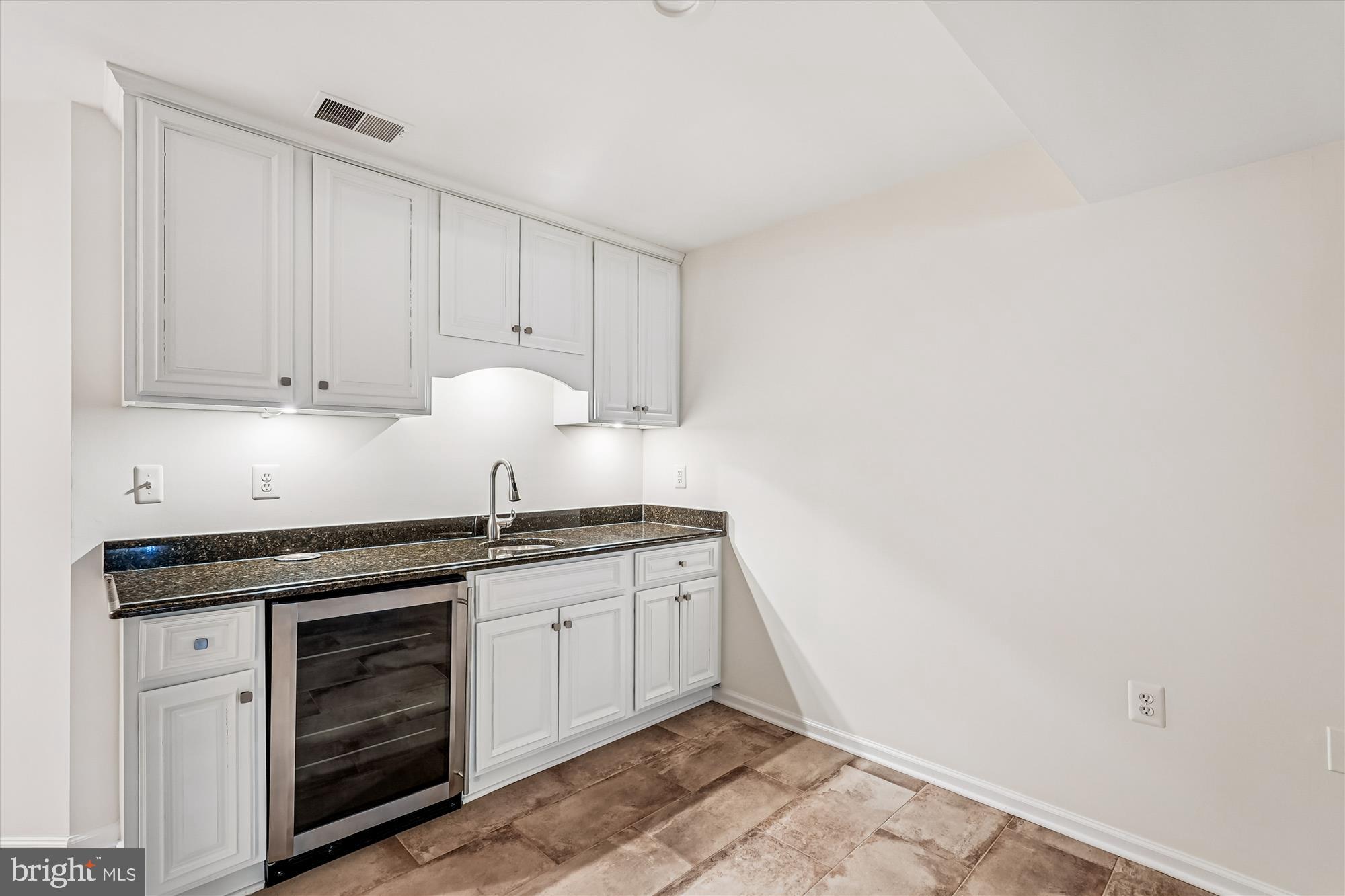 43439 Wild Dunes Square Leesburg, VA 20176 - Photo 22 of 51 Wet bar in lower level