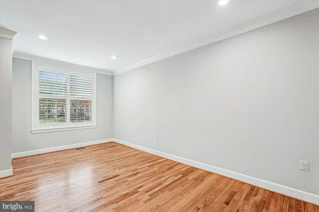 a view of entryway with wooden floor and stair