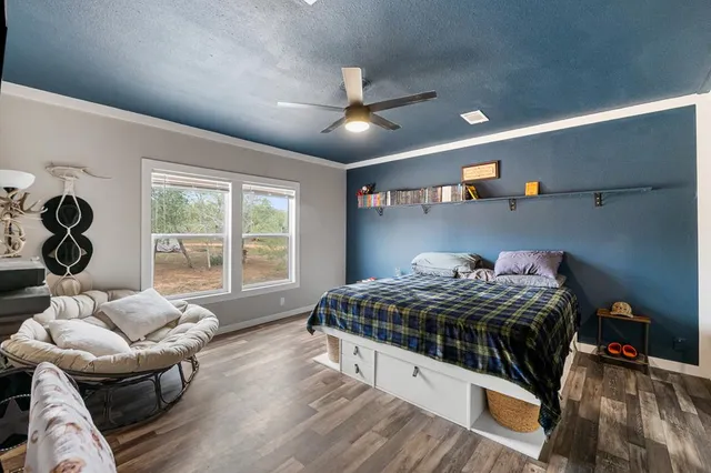 a bedroom with a bed and a couch