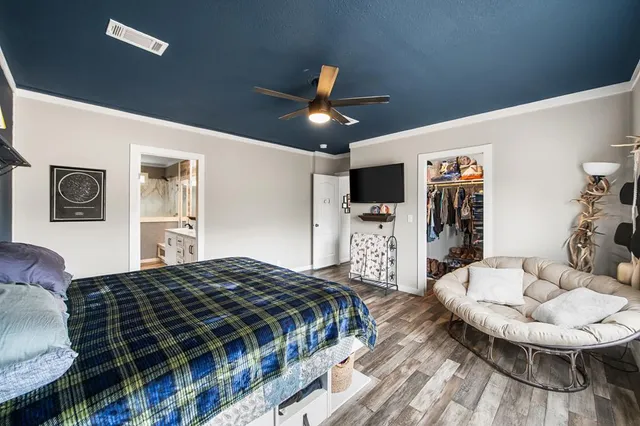 a bedroom with a bed window and a couch