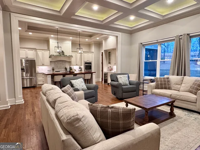 a bathroom with a granite countertop sink mirror and bathtub