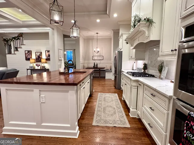 a bathroom with a sink mirror and a toilet