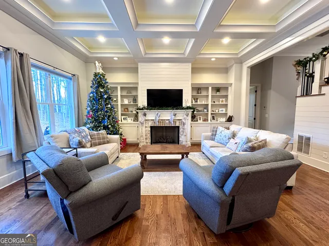 a living room with furniture and a christmas tree