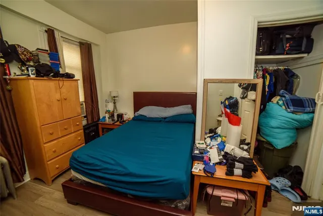 a room with lots of books and white walls