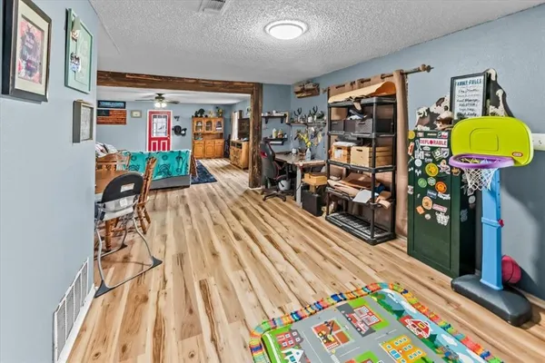 a bed room with a bed and a flat screen tv