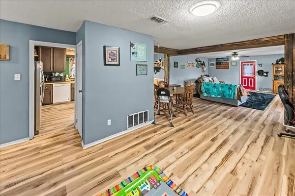 a kitchen with stainless steel appliances kitchen island granite countertop a refrigerator oven stove and a sink