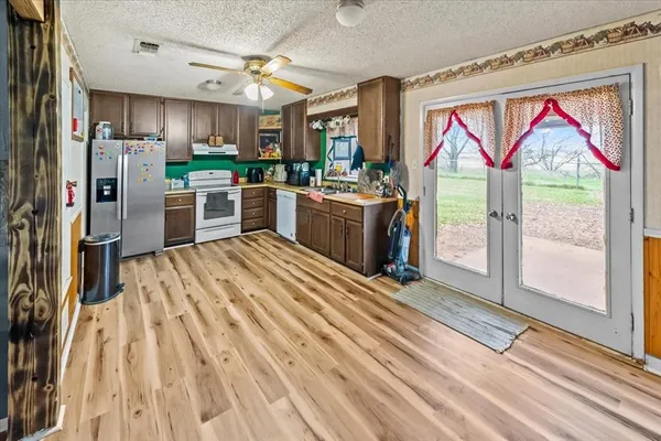 a kitchen with a stove and a refrigerator
