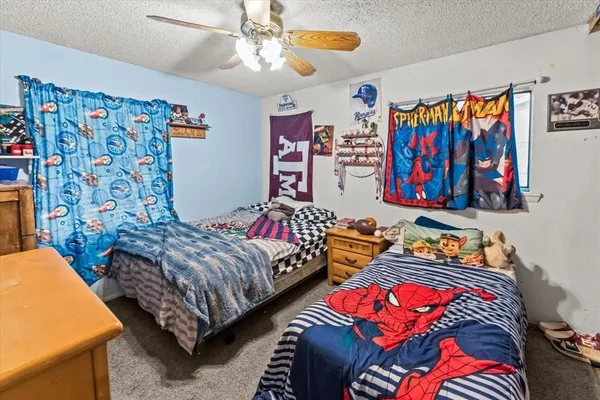 a bed room with furniture and wooden floor