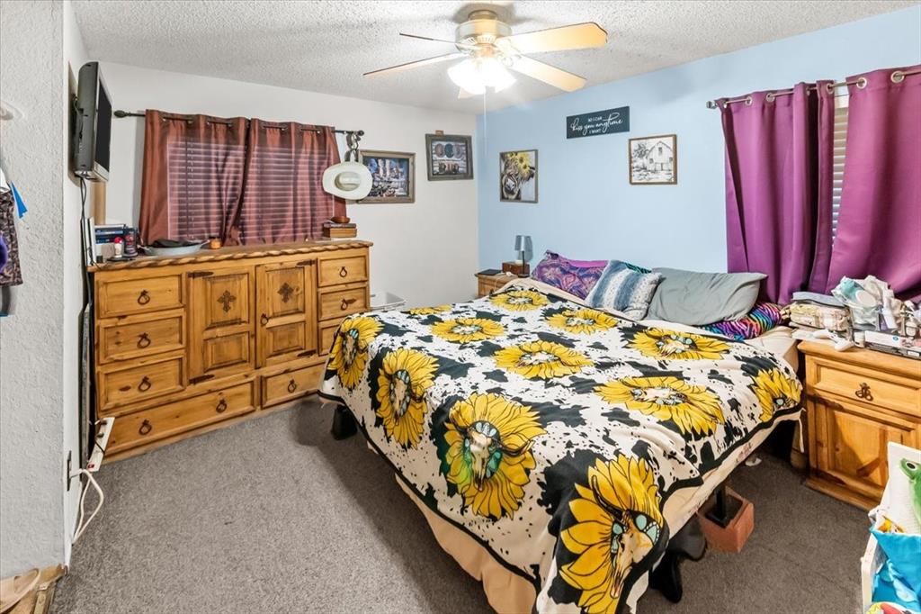 600 South Colorado Street Whitney, TX 76692 - Photo 24 of 26 a bed sitting in a bedroom next to a window