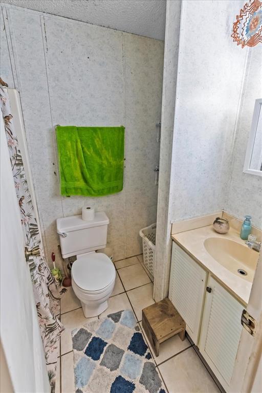 600 South Colorado Street Whitney, TX 76692 - Photo 25 of 26 a bathroom with a toilet and a sink