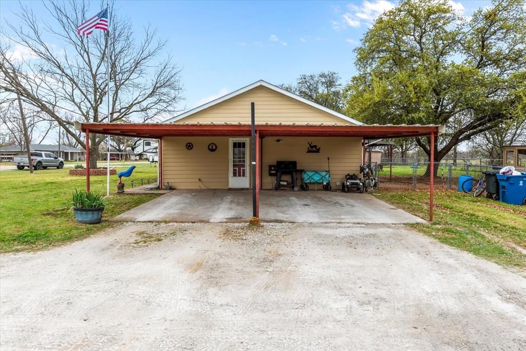 600 South Colorado Street Whitney, TX 76692 - Photo 4 of 26 a view of a house with a yard and large tree