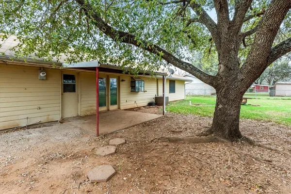 a house with trees in the background