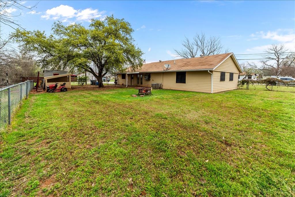600 South Colorado Street Whitney, TX 76692 - Photo 9 of 26 a front view of a house with garden