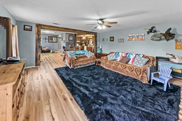 a living room with furniture rug and window