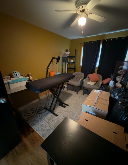 2571 Suffield Street Des Plaines, IL 60016 - Photo 4 of 10 a living room with furniture and a chandelier