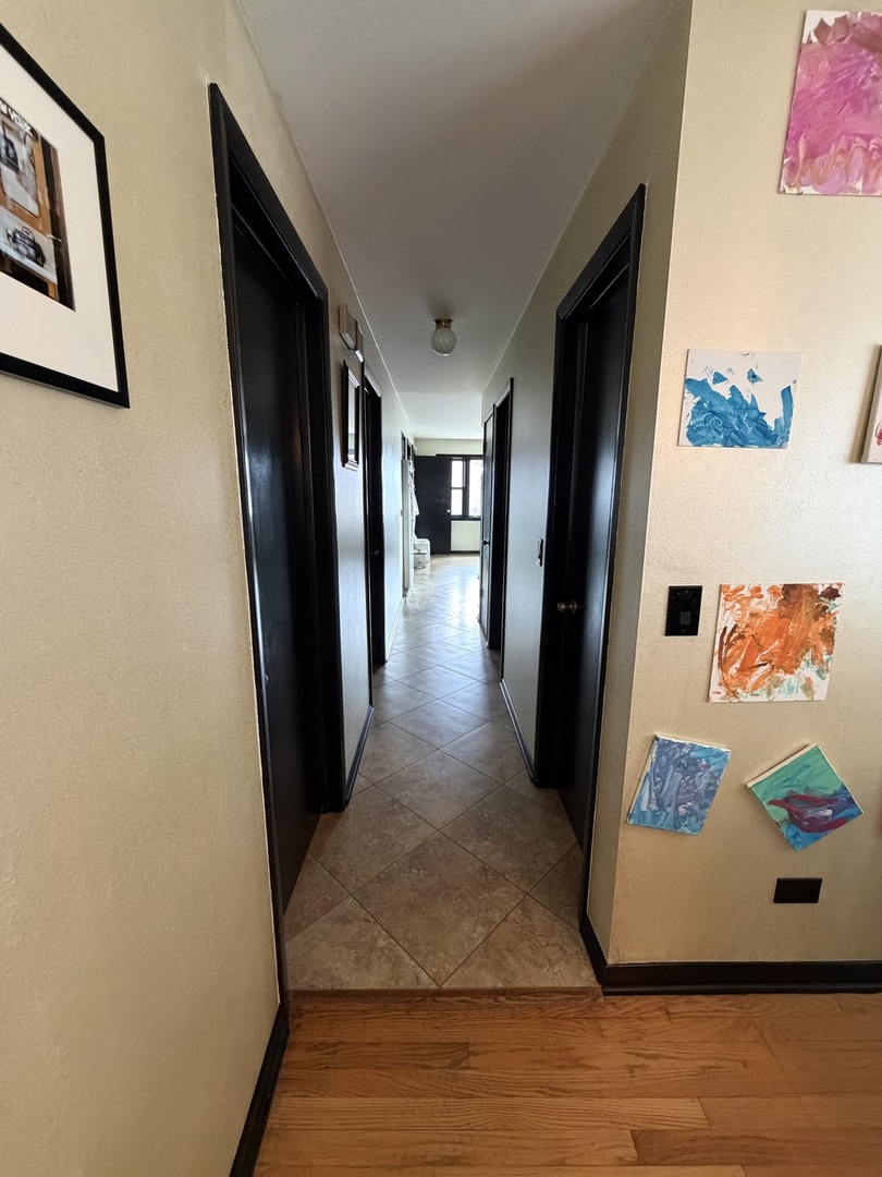 2571 Suffield Street Des Plaines, IL 60016 - Photo 6 of 10 a view of a hallway with paintings on the wall